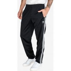 Adidas Originals Firebird Spodnie dresowe Czarny. Czarne spodnie męskie adidas Originals, l, bez wzorów, z poliesteru. Za 250,95 zł.
