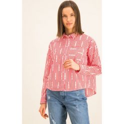 Koszula Tommy Jeans Logo Stripe DW0DW07618. Niebieskie bluzki damskie Tommy Jeans, s, bez wzorów, z jeansu, bez kołnierzyka, bez rękawów. W wyprzedaży za 249,00 zł.