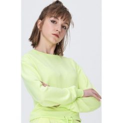 Bluza ze ściągaczem - Żółty. Żółte bluzy damskie Sinsay, s, bez wzorów, bez rękawów, bez kaptura. Za 39,99 zł.