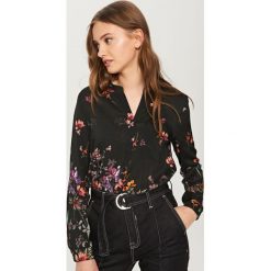 Koszula w kwiaty - Czarny. Niebieskie koszule damskie marki KIPSTA, z materiału, młodzieżowe. Za 79,99 zł.