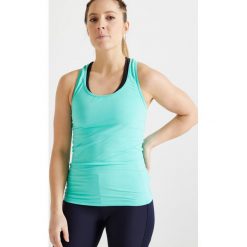 Top fitness cardio 100 damski. Zielone topy damskie DOMYOS, bez wzorów, z elastanu, bez kołnierzyka. Za 19,99 zł.