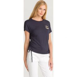 T-SHIRT ARRICIO FIANCHI Aeronautica Militare. Niebieskie t-shirty damskie Aeronautica Militare, s, z aplikacjami, z elastanu, z okrągłym kołnierzem. Za 439,00 zł.