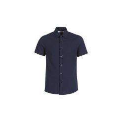 Koszule z krótkim rękawem Calvin Klein Jeans CKJ SLIM STRETCH BARI SS. Niebieskie koszule męskie Calvin Klein Jeans, xl, bez wzorów, z jeansu, bez kołnierzyka, z krótkim rękawem. Za 216,30 zł.