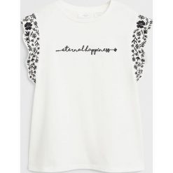 Mango Kids - T-shirt dziecięcy Eternal 110-134 cm. Białe bluzki dziewczęce Mango Kids, z aplikacjami, z bawełny, z okrągłym kołnierzem, z krótkim rękawem, krótkie, bez kaptura. W wyprzedaży za 49,90 zł.