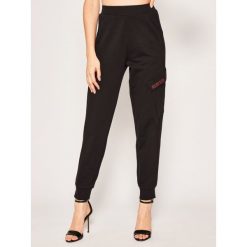 Spodnie dresowe Calvin Klein Performance Essential Knit 00GWS0P663. Czarne spodnie damskie Calvin Klein Performance, l, z bawełny. W wyprzedaży za 279,00 zł.