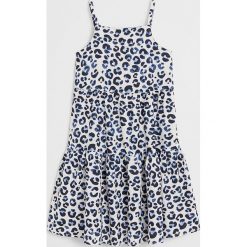 Mango Kids - Sukienka dziecięca Begur 116-164 cm. Białe sukienki dziewczęce Mango Kids, bez wzorów, z wiskozy, bez rękawów, mini, rozkloszowane. Za 99,90 zł.