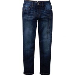 Dżinsy ze stretchem Slim Fit bonprix ciemnoniebieski "stone". Niebieskie spodnie chłopięce bonprix, z nadrukiem, z jeansu, eleganckie. Za 79,99 zł.