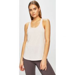 Under Armour - Top. Różowe topy sportowe damskie Under Armour, s, bez wzorów, z bawełny, bez rękawów. W wyprzedaży za 59,90 zł.