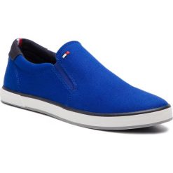 Tenisówki TOMMY HILFIGER - Iconic Slip On Sneaker FM0FM00597 Mazarine Blue 440. Niebieskie półbuty męskie TOMMY HILFIGER, na co dzień, bez wzorów, z gumy, klasyczne, bez zapięcia. Za 269,00 zł.