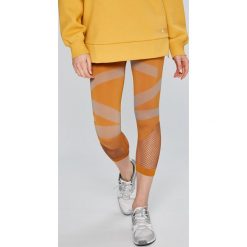 Adidas by Stella McCartney - Legginsy. Pomarańczowe legginsy marki adidas by Stella McCartney, s, z elastanu. W wyprzedaży za 239,90 zł.