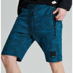 Szorty camo o kroju jogger - Niebieski. Niebieskie spodenki i szorty męskie Cropp, s, bez wzorów. Za 79,99 zł.