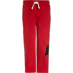 GAP BOYS ACTIVE ARCH Spodnie treningowe modern red. Czerwone spodnie dresowe dziewczęce marki GAP, z bawełny. Za 129,00 zł.