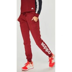 Adidas Performance - Spodnie. Czerwone spodnie damskie adidas Performance, s, z nadrukiem, z bawełny. Za 169,90 zł.