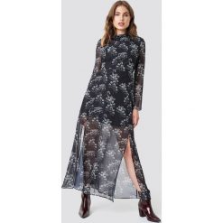 Trendyol Długa sukienka z nadrukiem - Black. Czarne sukienki damskie marki Trendyol, z nadrukiem, bez kołnierzyka, z długim rękawem, długie, maxi. Za 121,95 zł.