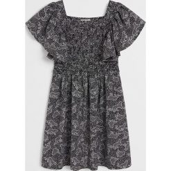 Mango Kids - Sukienka dziecięca Africa 110-164 cm. Czarne sukienki dziewczęce Mango Kids, bez wzorów, z wiskozy, z krótkim rękawem, krótkie, mini, rozkloszowane. W wyprzedaży za 79,90 zł.