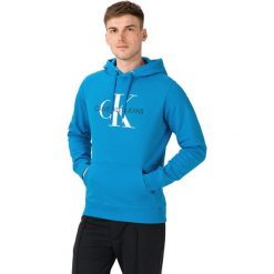 Calvin Klein Monogram Bluza Niebieski. Niebieskie bluzy męskie Calvin Klein, s, z nadrukiem, z bawełny, bez kołnierzyka, bez rękawów, bez kaptura. Za 497,95 zł.