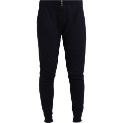 Spodnie dresowe damskie: Betty & Co Spodnie treningowe night sky