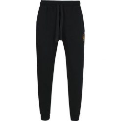 Spodnie dresowe Emporio Armani. Czarne spodnie męskie Emporio Armani, na co dzień, m, bez wzorów, z bawełny. Za 199,00 zł.