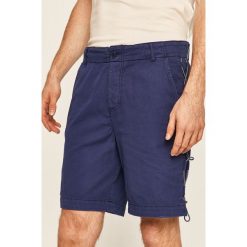 Desigual - Szorty. Niebieskie spodenki i szorty męskie Desigual, bez wzorów, z bawełny, casualowe. W wyprzedaży za 269,90 zł.