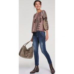 Bluzka ze wzorem. Bluzki damskie Heine, bez wzorów, bez kołnierzyka, bez rękawów. W wyprzedaży za 129,95 zł.