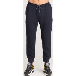 SPODNIE DRESOWE Armani Exchange. Niebieskie spodnie męskie m, z aplikacjami, z elastanu. Za 305,40 zł.