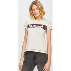 Hummel - Top. Białe bluzki damskie Hummel, s, z nadrukiem, z elastanu, z okrągłym kołnierzem. W wyprzedaży za 69,90 zł.