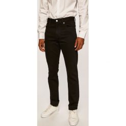 Calvin Klein - Jeansy Harry Black. Czarne jeansy męskie Calvin Klein, z aplikacjami. W wyprzedaży za 359,90 zł.