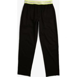 Calvin Klein - Męskie spodnie od piżamy, czarny. Czarne piżamy męskie Calvin Klein, s, bez wzorów, z bawełny. Za 149,95 zł.