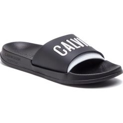 Klapki CALVIN KLEIN - Slide KW0KW00779 930. Czarne klapki damskie marki Calvin Klein, bez wzorów, z tworzywa sztucznego, bez obcasa. Za 129,00 zł.