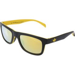 Okulary przeciwsłoneczne "AOR005 BA7004" w kolorze czarno-żółtym. Żółte okulary przeciwsłoneczne męskie marki Nike & adidas, z tworzywa sztucznego. W wyprzedaży za 219,95 zł.