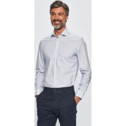Tommy Hilfiger Tailored - Koszula. Białe koszule męskie Tommy Hilfiger Tailored, bez wzorów, z elastanu, klasyczne, z klasycznym kołnierzykiem, z długim rękawem. W wyprzedaży za 219,90 zł.