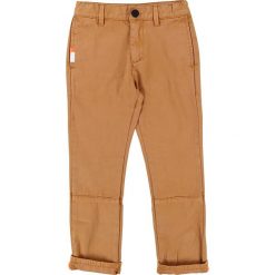 Spodnie w kolorze jasnobrązowym. Pomarańczowe spodnie niemowlęce Billieblush & Billybandit, w paski. W wyprzedaży za 75,95 zł.