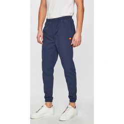 Ellesse - Spodnie. Niebieskie spodnie męskie marki Ellesse, na co dzień, m, bez wzorów, z materiału, casualowe. Za 189,90 zł.