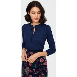 Elegancka bluzka. Bluzki damskie Greenpoint, bez wzorów, z elastanu, eleganckie, bez kołnierzyka, bez rękawów. Za 69,99 zł.