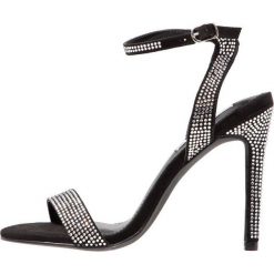 Steve Madden LANDEN Sandały na obcasie black. Czarne sandały damskie Steve Madden, z materiału, na obcasie. Za 419,00 zł.