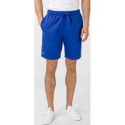 Lacoste Szorty Niebieski. Niebieskie spodenki sportowe męskie Lacoste, l, bez wzorów, z bawełny, sportowe. Za 266,95 zł.