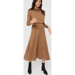 Spódnica w kolorze jasnobrązowym. Pomarańczowe spódniczki damskie Rodier, xl, z wełny, klasyczne, z podwyższonym stanem, midi, asymetryczne. W wyprzedaży za 189,95 zł.
