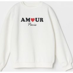 Bluza dresowa z napisem - Kremowy. Białe bluzy damskie Reserved, z napisami, z dresówki, bez rękawów, bez kaptura. Za 45,99 zł.