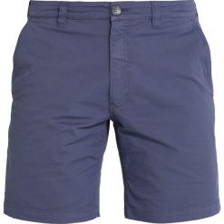 HUEZ QUATTRE SHORT Krótkie spodenki sportowe jimy. Niebieskie spodenki i szorty męskie HUEZ, m, bez wzorów, z elastanu, sportowe. Za 409,00 zł.