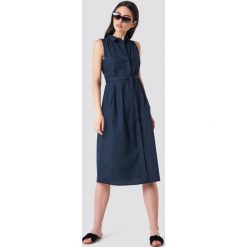MANGO Sukienka koszulowa z paskiem - Navy. Niebieskie sukienki na komunię Mango, w paski, z koszulowym kołnierzykiem, bez rękawów, midi, koszulowe. Za 161,95 zł.