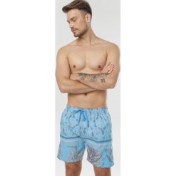 Jasnoniebieskie Szorty Jenylena. Niebieskie spodenki i szorty męskie Born2be, xl, bez wzorów. W wyprzedaży za 29,99 zł.