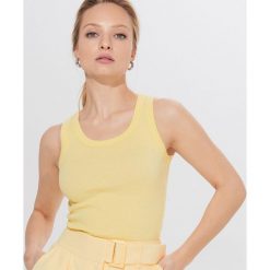 Top z bawełny organicznej Eco Aware - Żółty. Żółte topy damskie Mohito, s, bez wzorów, z bawełny, bez kołnierzyka. Za 19,99 zł.