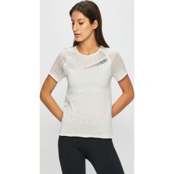 Under Armour - Top sportowy. Różowe topy damskie Under Armour, s, bez wzorów, z nylonu, z okrągłym kołnierzem. W wyprzedaży za 199,90 zł.