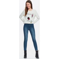 Spodnie jeansowe damskie, rurki. Niebieskie spodnie damskie TROLL, s, z jeansu. W wyprzedaży za 39,99 zł.