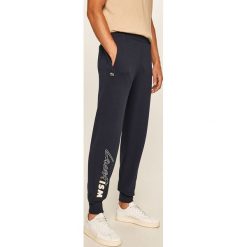 Lacoste - Spodnie. Niebieskie spodnie męskie Lacoste, na co dzień, s, z nadrukiem, z elastanu. W wyprzedaży za 359,90 zł.