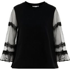 McQ Alexander McQueen GOTH HYBRID TOP Bluza darkest black. Czarne topy damskie marki McQ Alexander McQueen, xs, bez wzorów, z bawełny, bez rękawów, bez kaptura. W wyprzedaży za 587,60 zł.