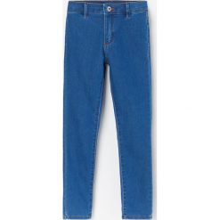 Spodnie jeansowe skinny fit - Niebieski. Niebieskie spodnie damskie Reserved, bez wzorów, z jeansu. Za 55,99 zł.