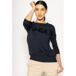 Sweter Guess Megan W0GR20 Z2NQ0. Białe swetry damskie Guess, xs, z aplikacjami, klasyczne, bez rękawów, bez kaptura. W wyprzedaży za 249,00 zł.