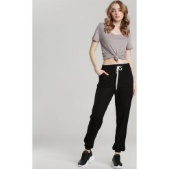Czarne Spodnie You Are My One. Czarne spodnie damskie Renee, s, z dresówki. Za 59,99 zł.