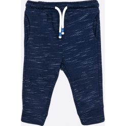 Blukids - Spodnie dziecięce 74-98 cm. Niebieskie spodnie chłopięce Blukids, bez wzorów, z bawełny, sportowe. W wyprzedaży za 19,90 zł.